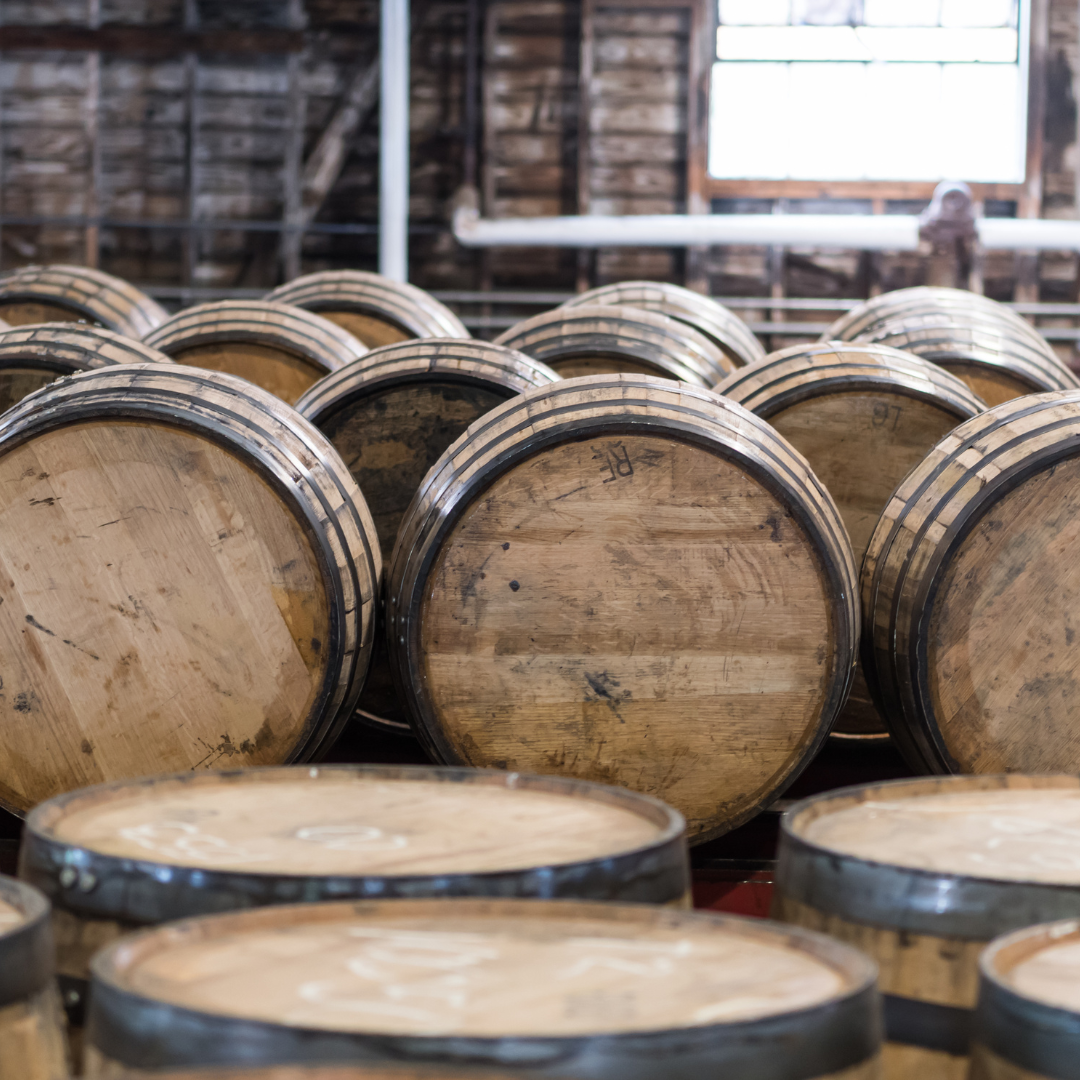 whiskey barrels on a distillery tour