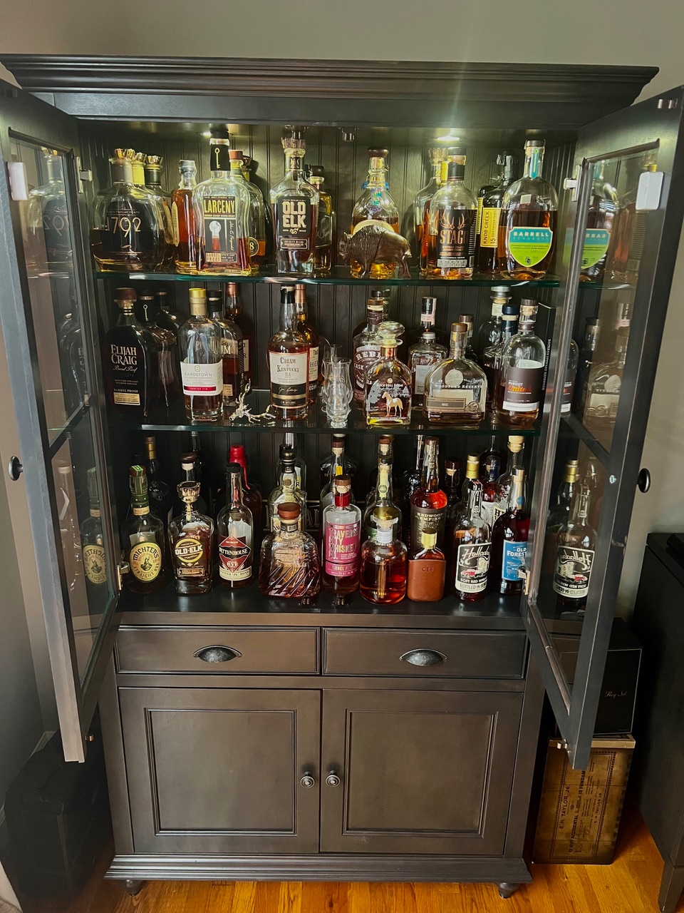 bourbon bottles in a cabinet