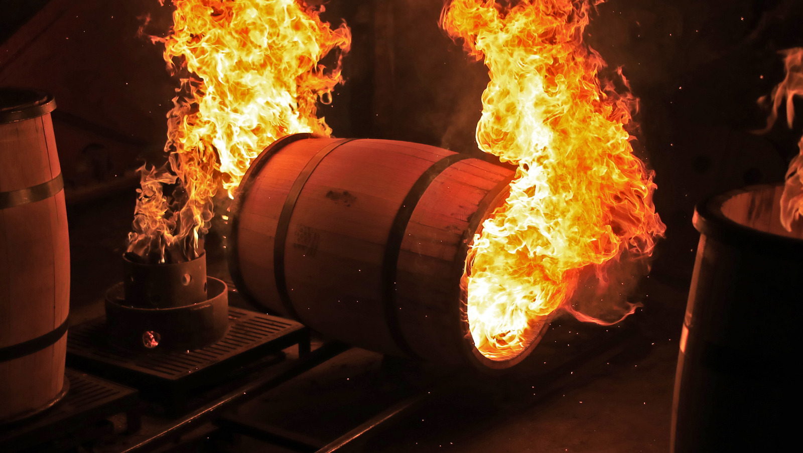 a bourbon barrel on fire being charred